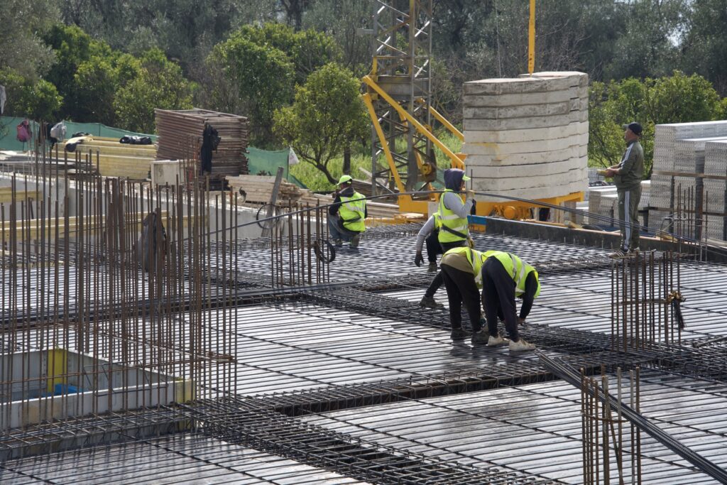 Reinforced columns and slab work in progress at Radhimë